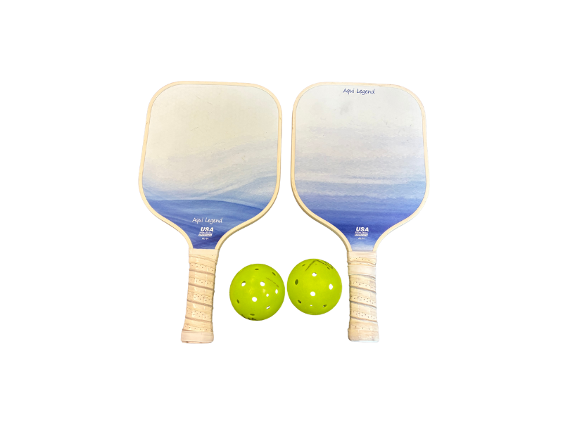 Two paddles and two balls to take to the pickle ball court