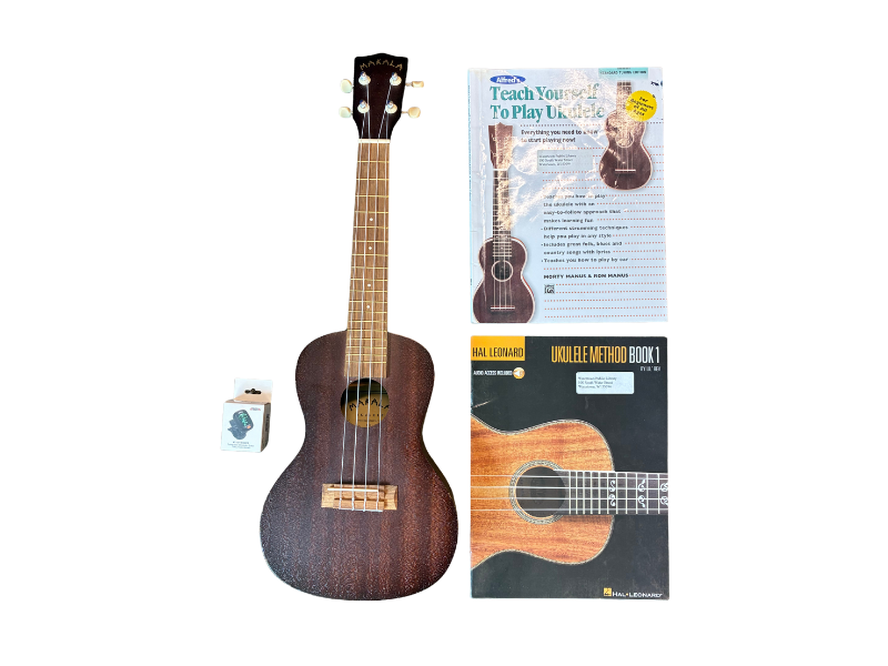 Ukulele with tuner and music books