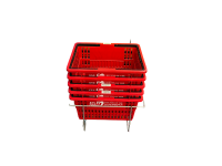 Stack of red small library shopping baskets.