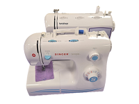 Two white sewing machines