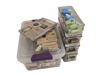 Plastic containers full of stamps and ink